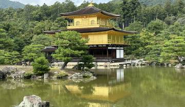 Kinkaku-ji, the Golden Pavilion, reflecting in a pond.