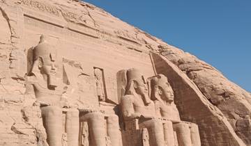 Abu Simbel statues carved into a rock face.