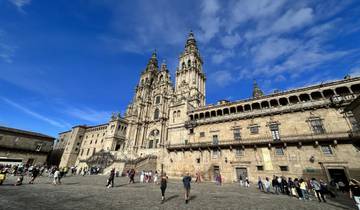 A grand cathedral in a bustling square under a bright sky.