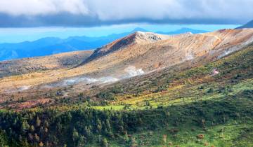 Colorful mountainous landscape with steam vents.