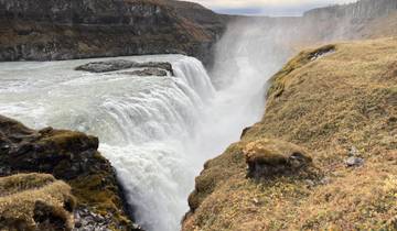 Powerful waterfall cascading into a canyon.