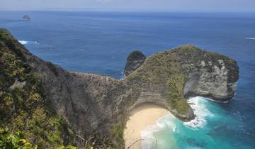 An awe-inspiring beach with dramatic cliffs and turquoise water.