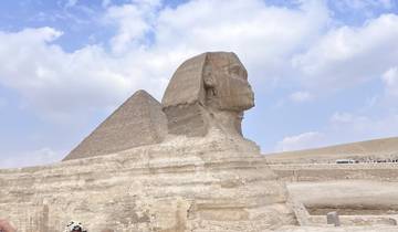 The iconic Sphinx in front of the Pyramids of Giza.