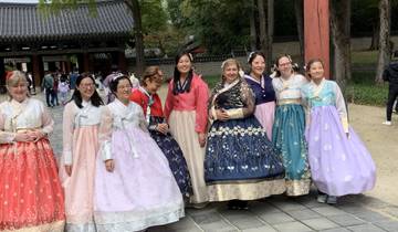A group of people wearing traditional Korean hanbok outfits.