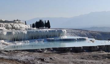 Natural terraced pools in a scenic landscape.