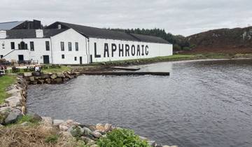 Laphroaig distillery by the water on a cloudy day.