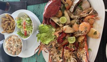 Seafood platter with side dishes on a table.