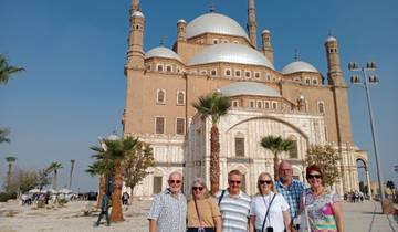 A group of people in front of the Mosque of Muhammad Ali.