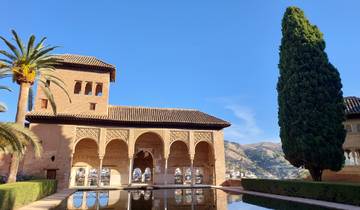 Picturesque view of a historical fort with water reflection.