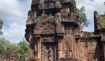 Banteay Srei, a richly decorated temple with detailed stone carvings.