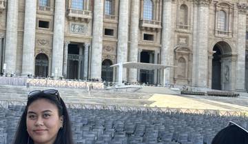 A woman standing in front of a famous historical building.