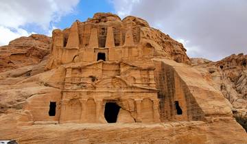Ancient rock-cut architecture with intricate designs.