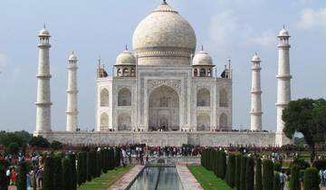 Iconic Taj Mahal with visitors in the foreground.