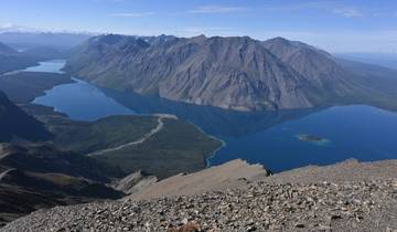 A breathtaking view of a lake surrounded by mountains.
