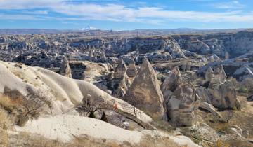 Panoramic view of rocky landscape with person