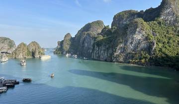 Picturesque view of limestone islands in Halong Bay with turquoise waters.