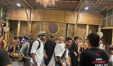 People participating in a cultural event with performers.