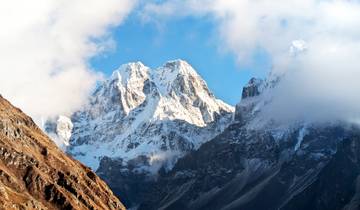 Majestic snow-capped mountains under a clear sky.