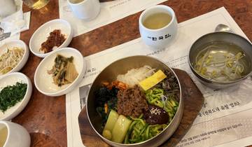 Traditional Korean meal served in bowls on a table.