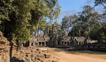 Angkor Wat temple complex surrounded by trees.