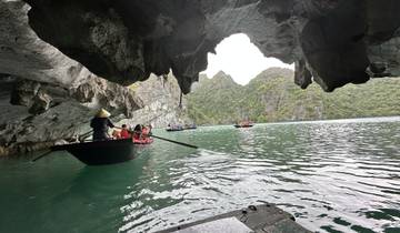 Tourists exploring a cave by boat.