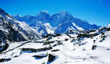 Snowy mountain landscape with clear blue skies.