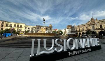 Fountain and buildings in a city square.