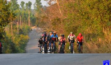 A group of cyclists on a rural road.