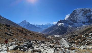 A vast mountainous landscape under a clear blue sky.