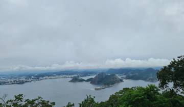 Aerial view of a bay and cityscape with iconic mountain