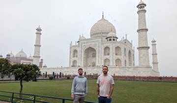 Two men standing in front of the Taj Mahal.