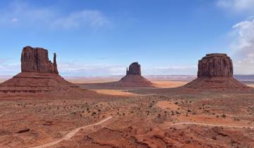 Wide view of Monument Valley with iconic buttes.