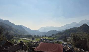 Panoramic view of rice terraces and mountains.