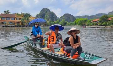 Group enjoying a boat ride in scenic surroundings.