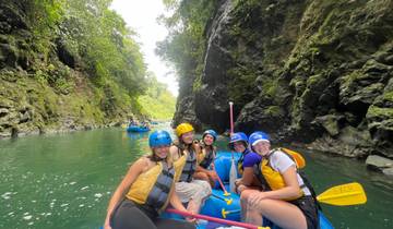Group of people enjoying rafting in a canyon.