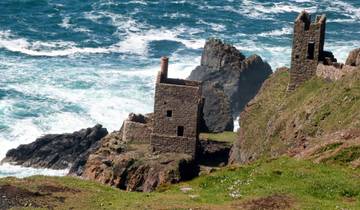 Rugged coastline with old mining buildings.