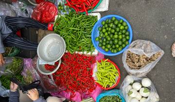 Markets with baskets of colorful vegetables and spices.