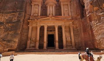 The Treasury in Petra, an iconic rock-cut temple with intricate carvings.