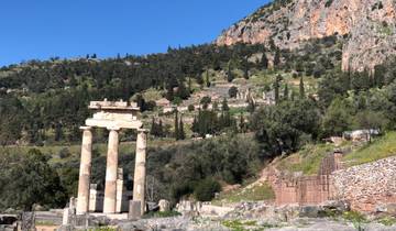 Ancient temple ruins with mountainous background.