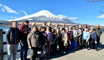 A group photo with Mount Fuji in the background.