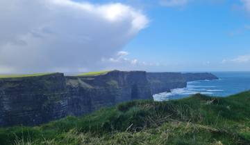 Cliffs of Moher against a cloudy sky.