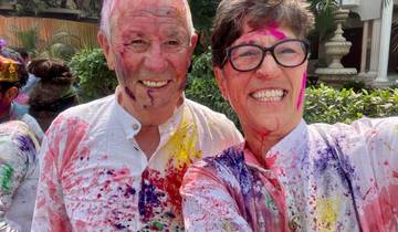 People covered in colorful powders during a festival celebration.