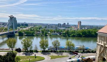 City view from a bridge over a river.