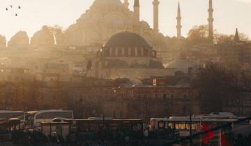 Scenic view of a historic mosque in a bustling city.