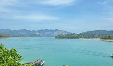 Scenic lake with mountains in the background.