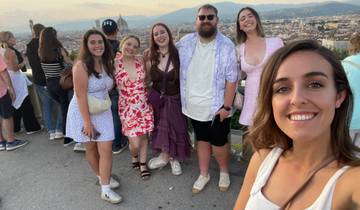 Group of young adults posing with Florence's skyline in the background.