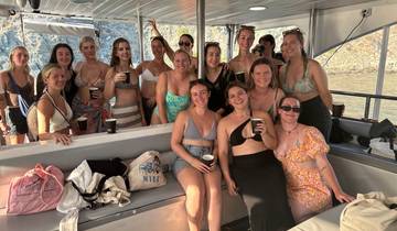Group of women enjoying drinks on a boat.