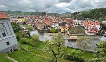 Panoramic view of a scenic town with a river running through it.