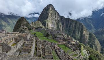 An iconic view of Machu Picchu with the famous ruins in the foreground.