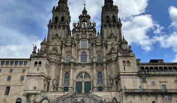 A grand cathedral with detailed architecture against a blue sky.